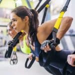 Women exercising on TRX