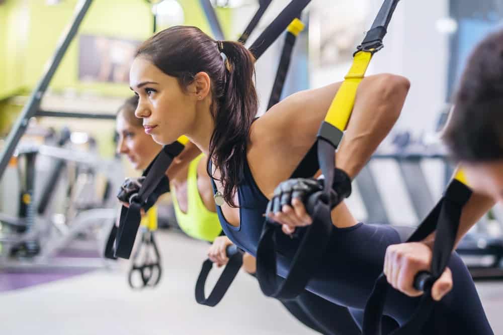 Women exercising on TRX